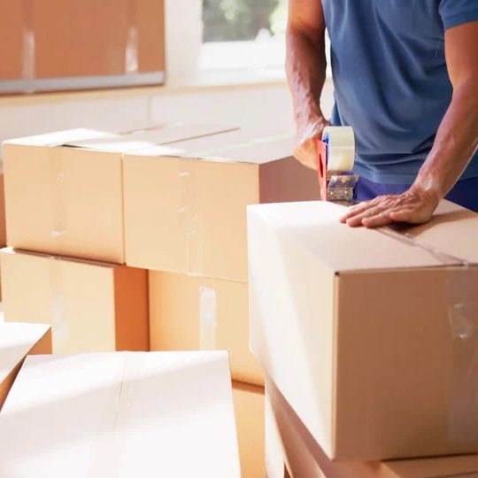 Labelled moving cartons stacked inside a villa in Abu Dhabi